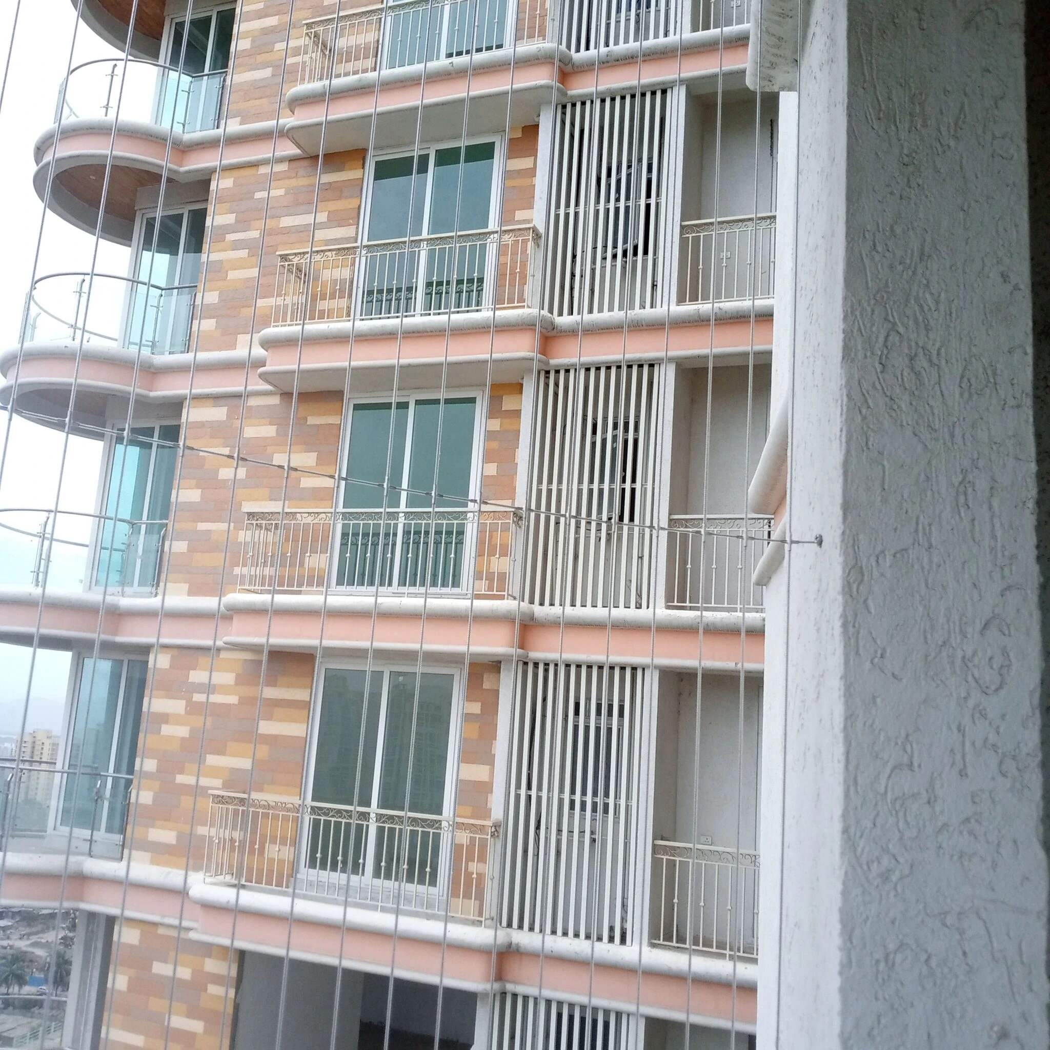 High-Rise Invisible Grill Installation in Mangalore Karnataka